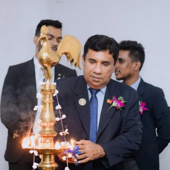 Lighting the traditional oil lamp at a club event